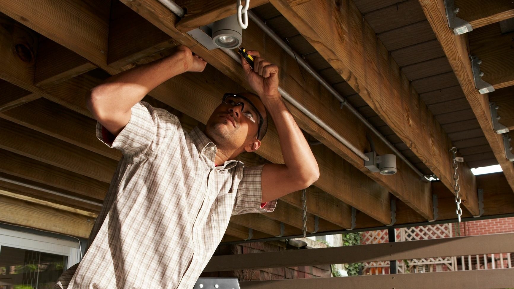 Man fixing ceiling joists
