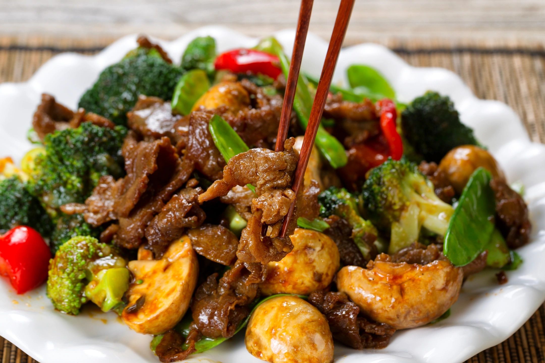 Plate of Beef with Broccoli and chop sticks