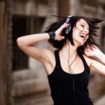 women listening to music on headphones