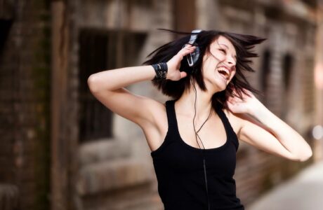 women listening to music on headphones