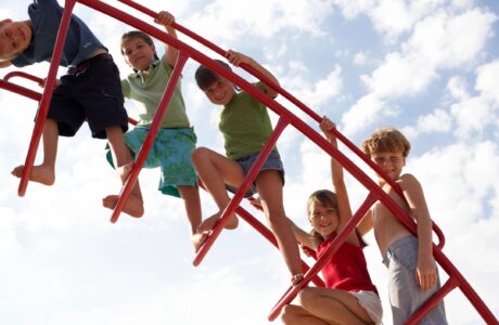 young children playing on jungle gym